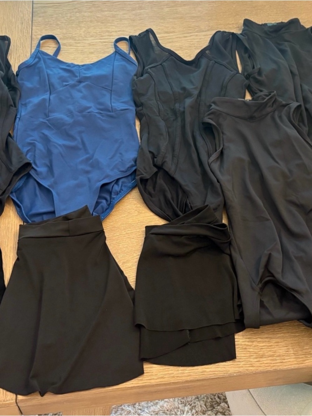Girls size 12-14 leotards (7 leos) and 3 skirts.